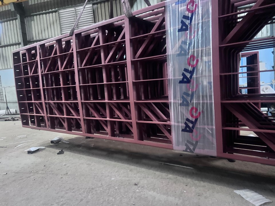 Crated lattice sections packed for dispatch from the works